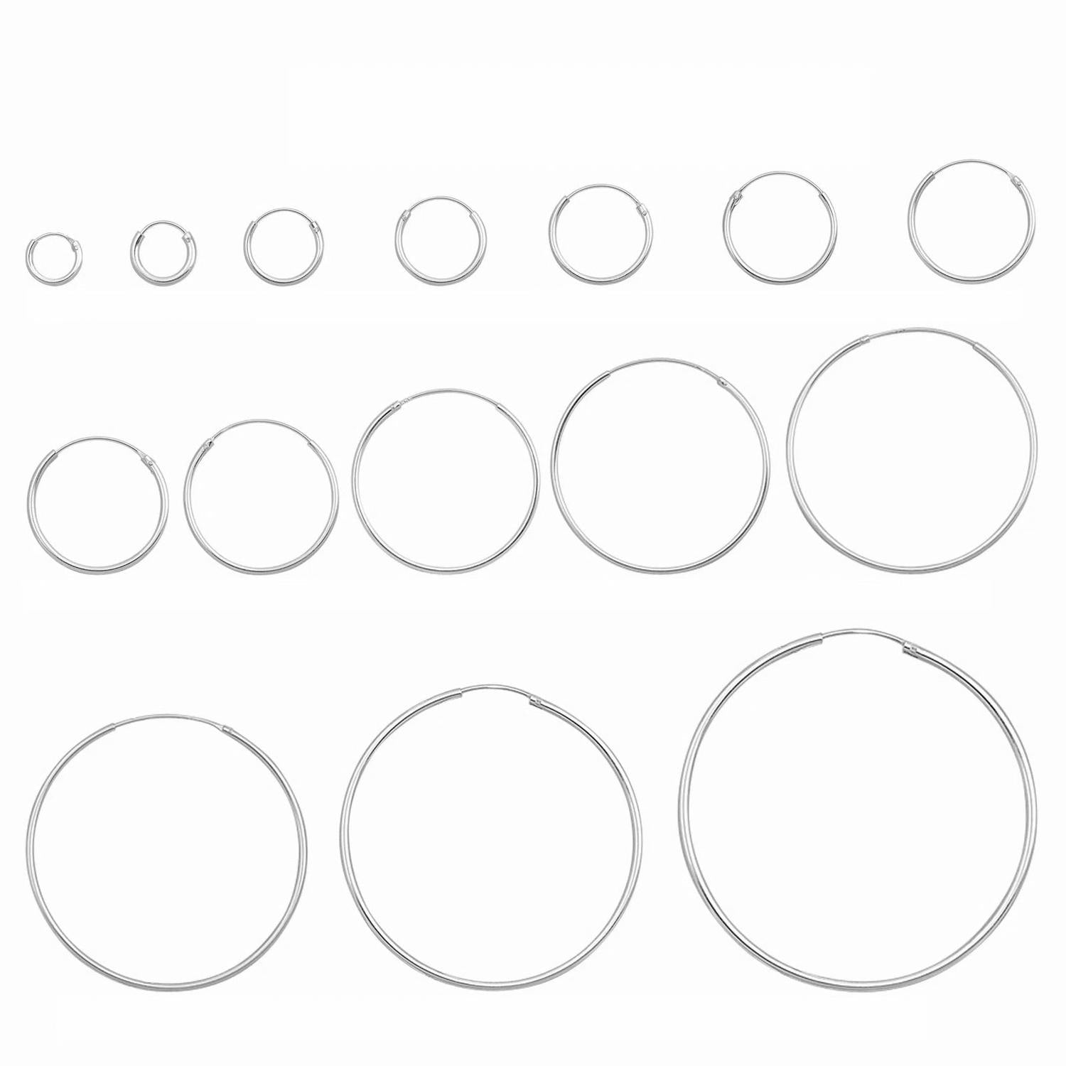 Melchior Jewellery display of multiple sizes of sterling silver rhodium plated hoop earrings in polished finish for everyday wear