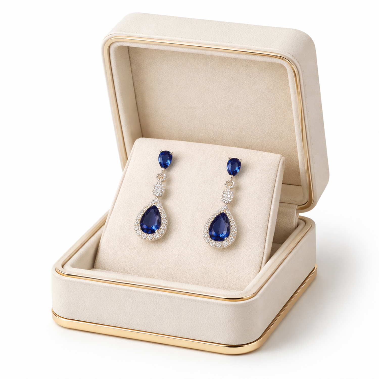 Melchior Jewellery sterling silver sapphire teardrop earrings presented in a cream velvet jewellery box