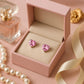 Melchior Jewellery sterling silver screw back earrings for kids with pink heart-shaped stones in a pink gift box