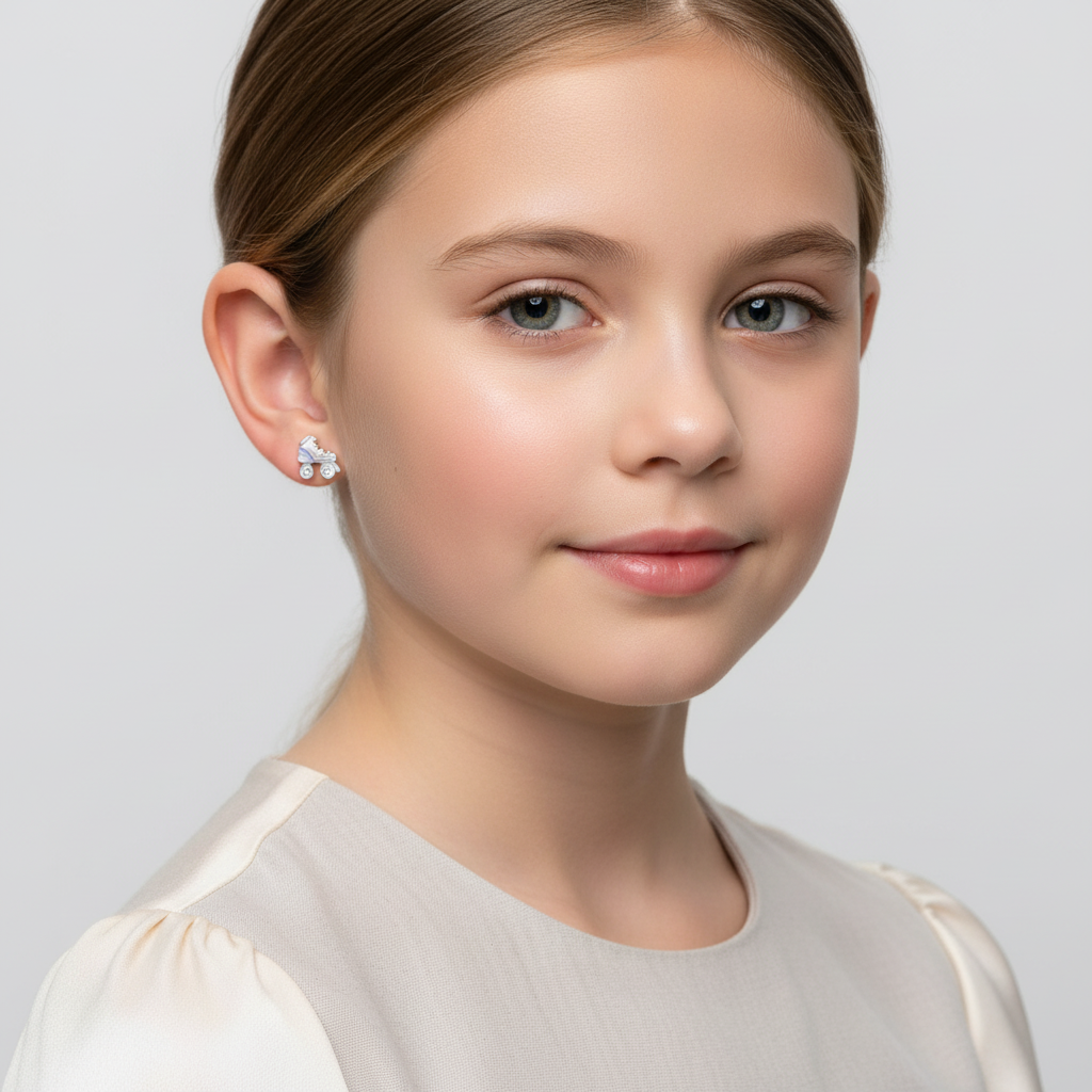 Young girl wearing sterling silver skate stud earrings from Melchior Jewellery on a white background