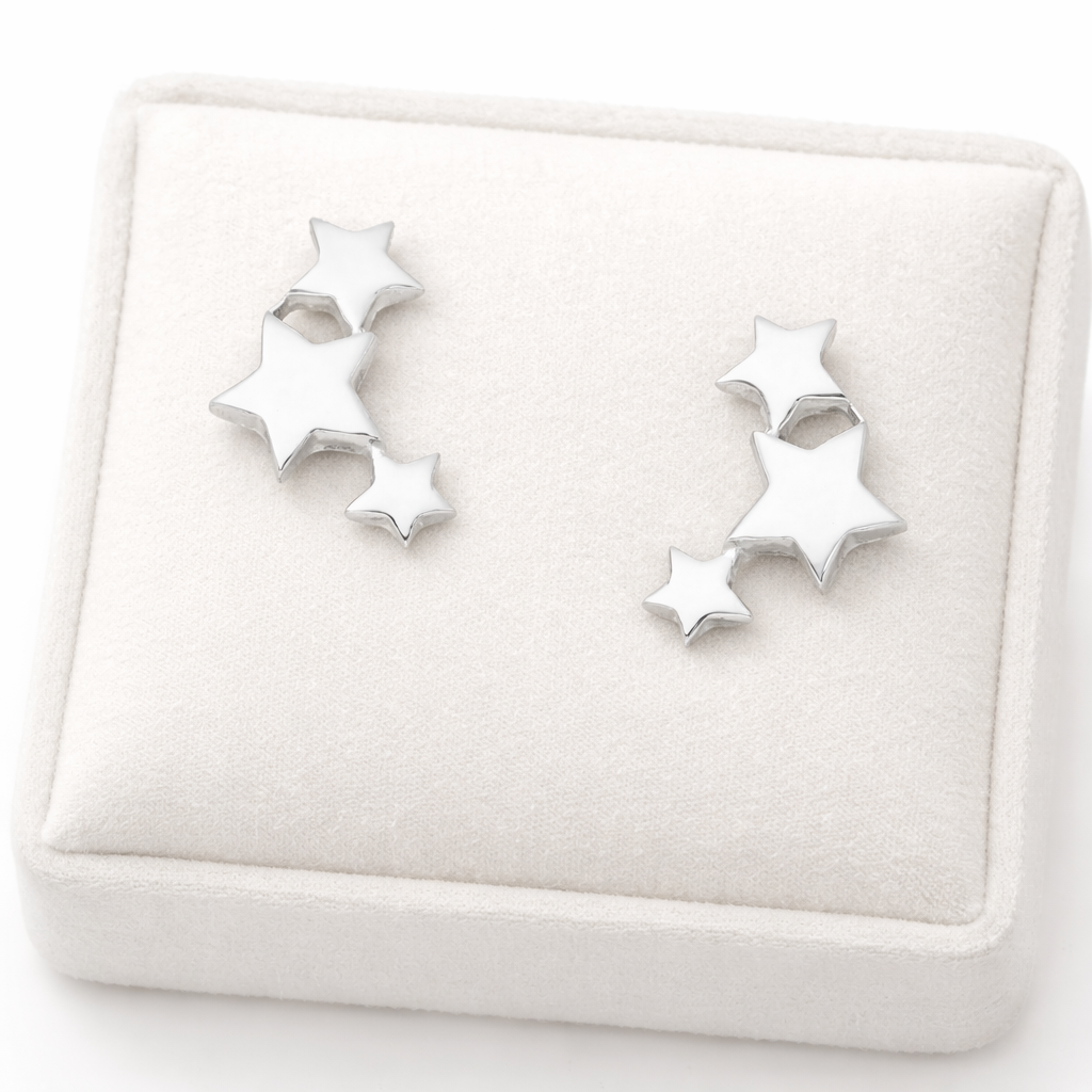 Melchior Jewellery sterling silver star stud earrings with three connected stars on cream display