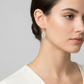 Melchior Jewellery sterling silver teardrop earrings worn by woman with smooth skin and neutral makeup