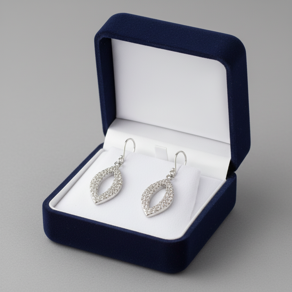 Melchior Jewellery sterling silver teardrop earrings with sparkling stones in navy velvet box