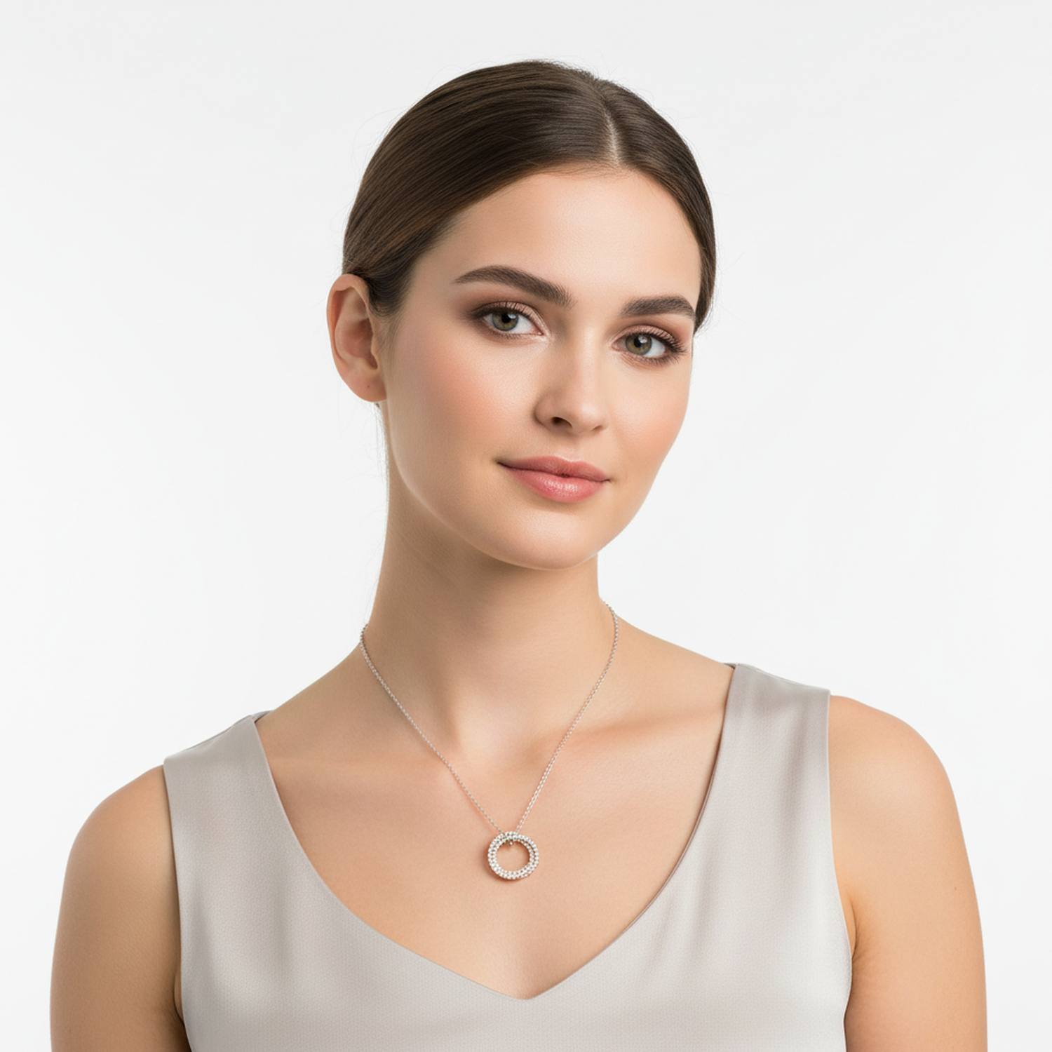 Woman wearing a sterling silver triple ring necklace by Melchior Jewellery with a simple elegant chain
