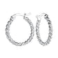 Melchior Jewellery sterling silver twisted hoop earrings with a polished twisted design for women