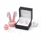 Melchior Jewellery sterling silver unicorn earrings for girls displayed in black box and pink stand with unicorn toy and cupcake