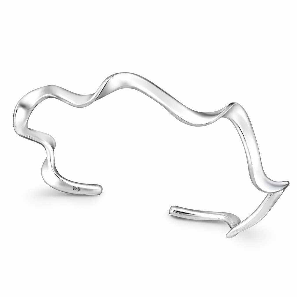 Sterling silver wave cuff bangle by Melchior Jewellery with a fluid, wavy design