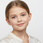 Young girl wearing Melchior Jewellery tiger stud earrings for children with a subtle smile