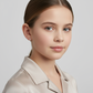 Young girl wearing tiny diamond cut hoop earrings for kids by Melchior Jewellery in silver finish