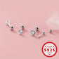 Melchior Jewellery tiny round CZ screw back earrings for kids in sterling silver set on pink background
