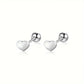 Melchior Jewellery titanium heart stud earrings in silver with smooth polished finish