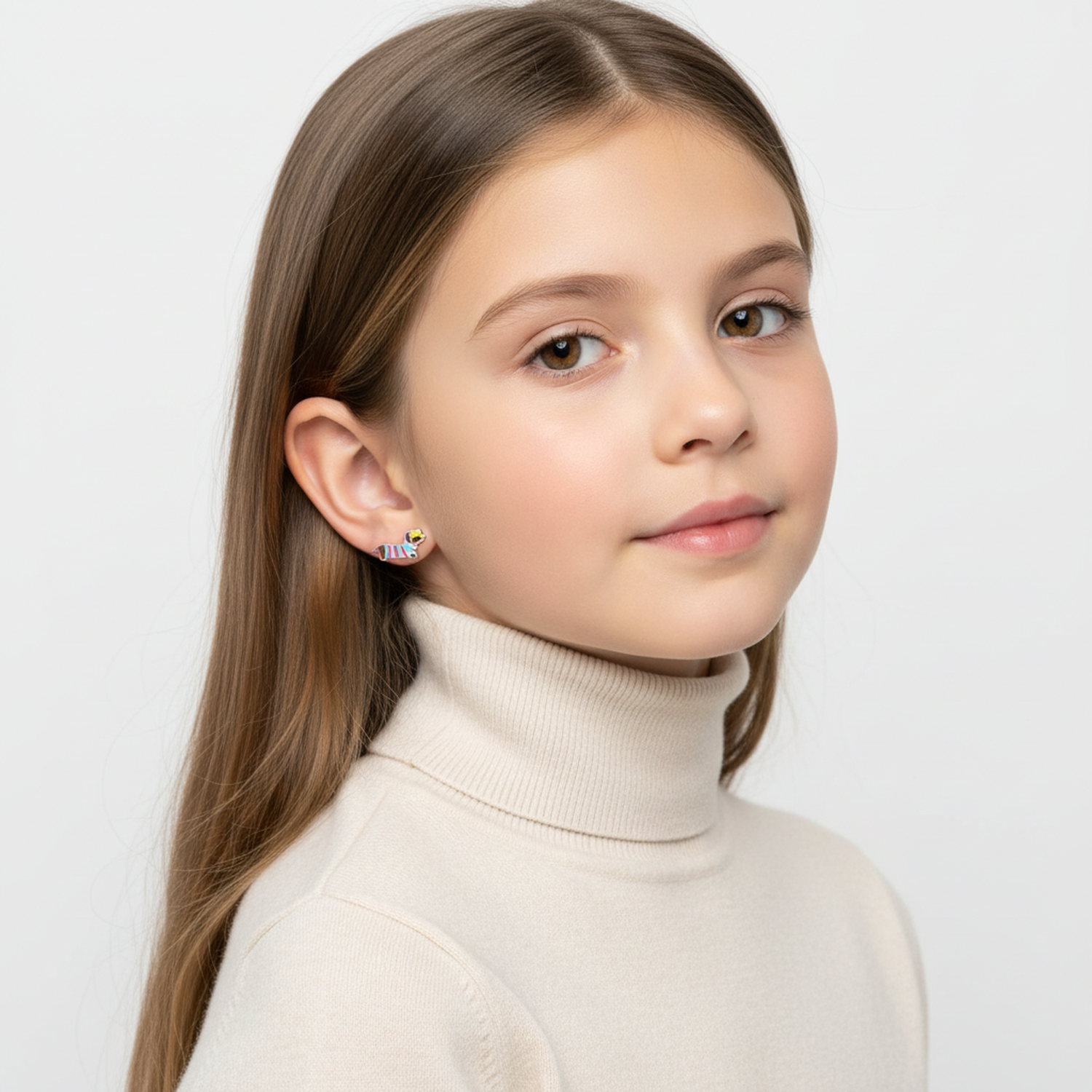 Girl wearing Melchior Jewellery sausage dog stud earrings for girls with colourful enamel design