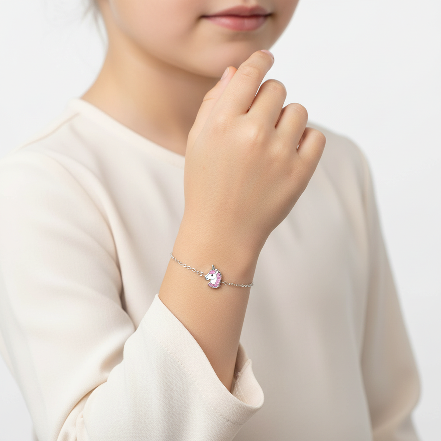 Melchior Jewellery unicorn charm bracelet child with silver chain worn on a child's wrist
