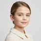 Young girl wearing unicorn stud earrings for girls by Melchior Jewellery in a cream shirt