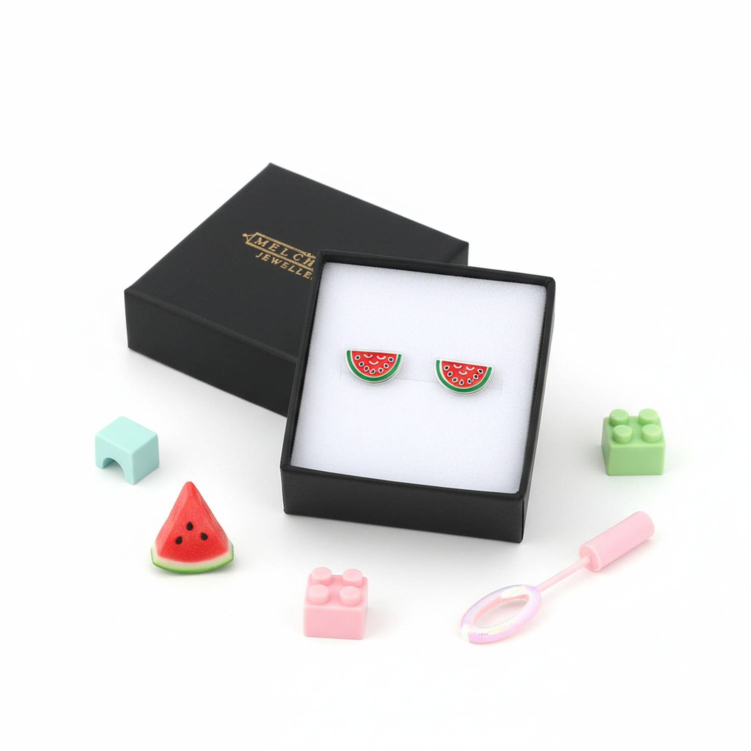 Colourful watermelon stud earrings for kids by Melchior Jewellery in black gift box with toy blocks and bubble wand