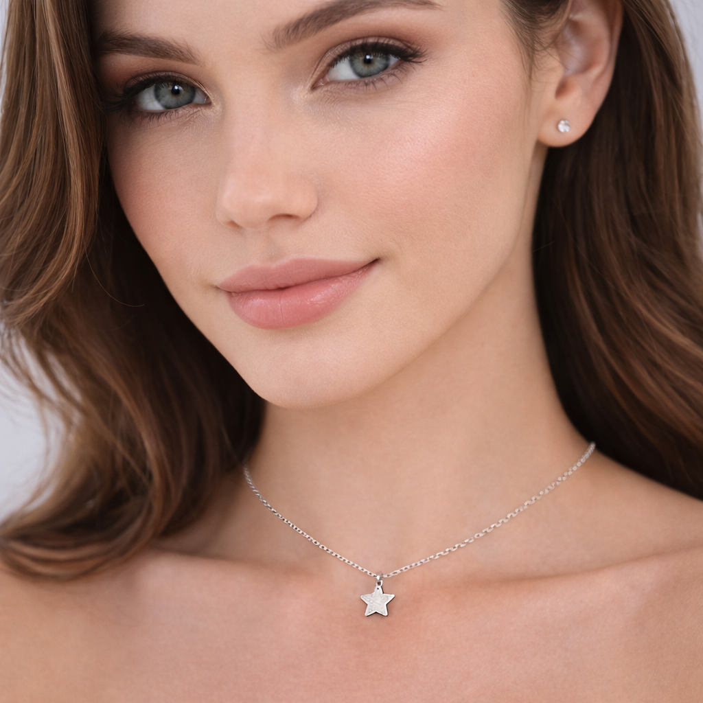 Womans plain star necklace sterling silver by Melchior Jewellery worn on model with natural makeup