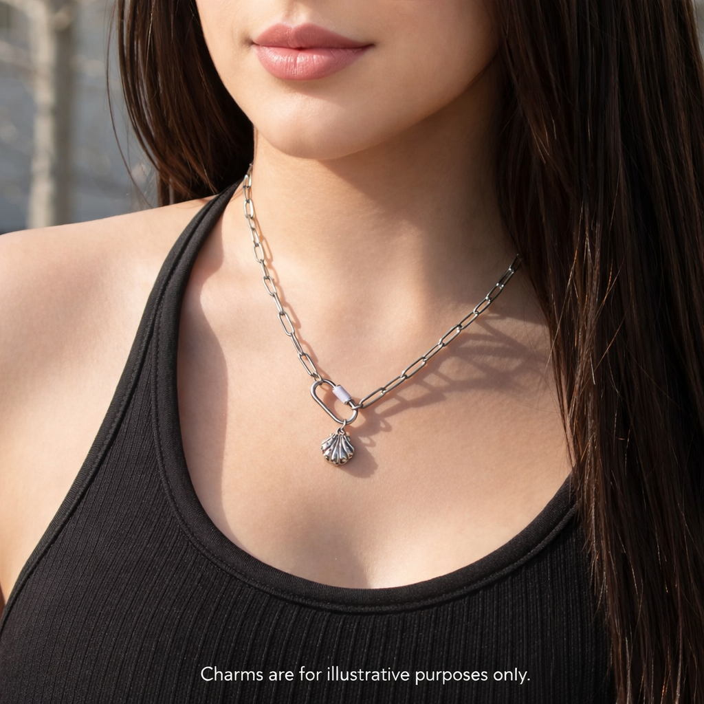 Melchior Jewellery stainless steel carabiner necklace in silver with shell charm worn with black ribbed top