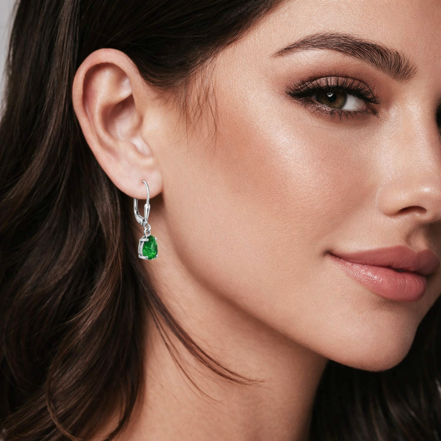 Melchior Jewellery Silver Emerald Bridal Teardrop Earrings worn by woman with natural makeup