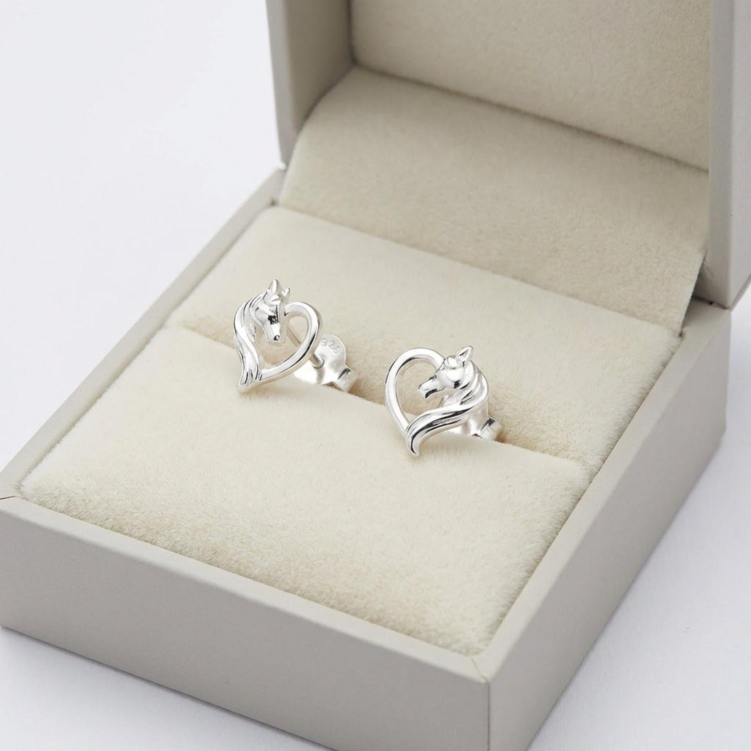 Melchior Jewellery kids horse stud earrings sterling silver in a beige jewellery box