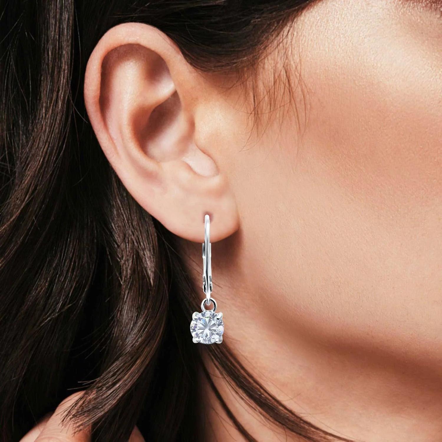 Melchior Jewellery Sterling Silver Solitaire CZ Leverback Earrings worn on womans ear