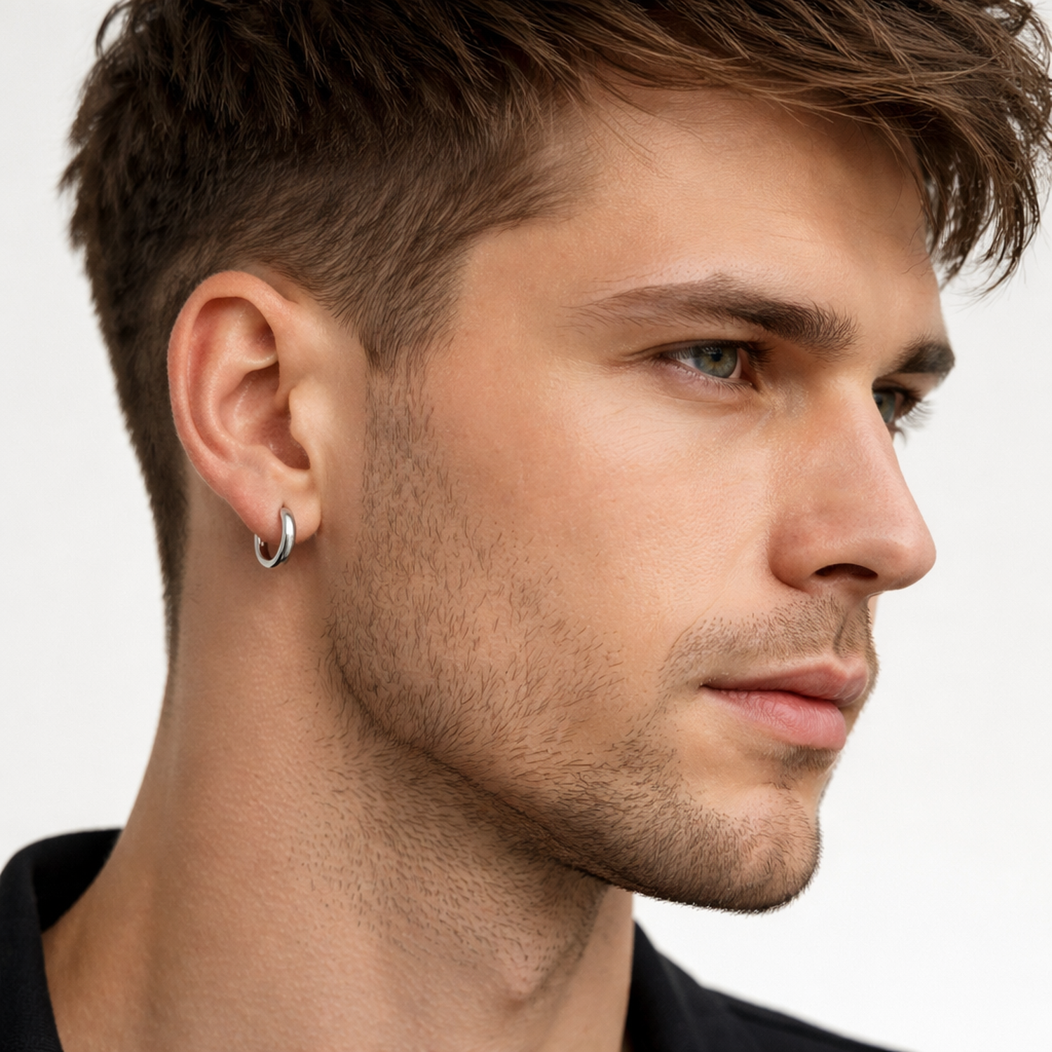 Close-up of a man wearing a silver 18mm mens hoop earring from Melchior Jewellery