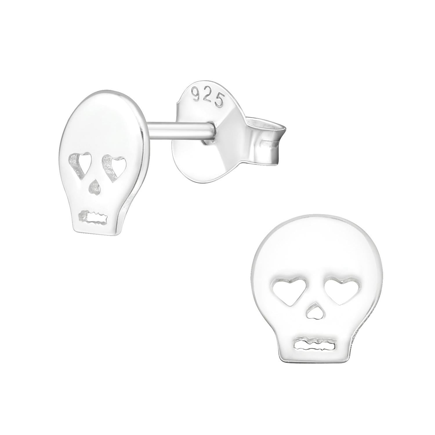 Sterling silver skull earrings with heart-shaped eyes designed for women by Melchior Jewellery