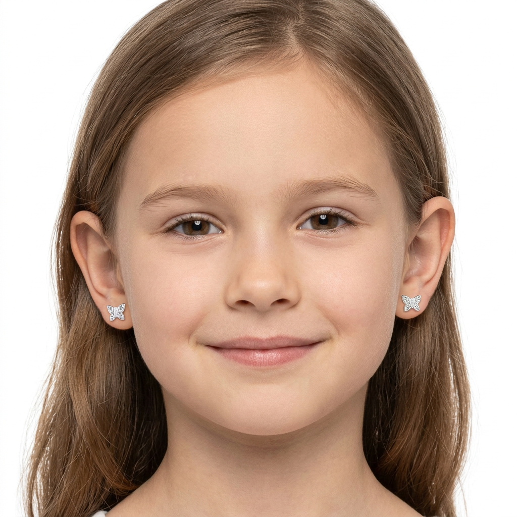 sterling silver butterfly stud earrings in white worn by young girl from Melchior Jewellery