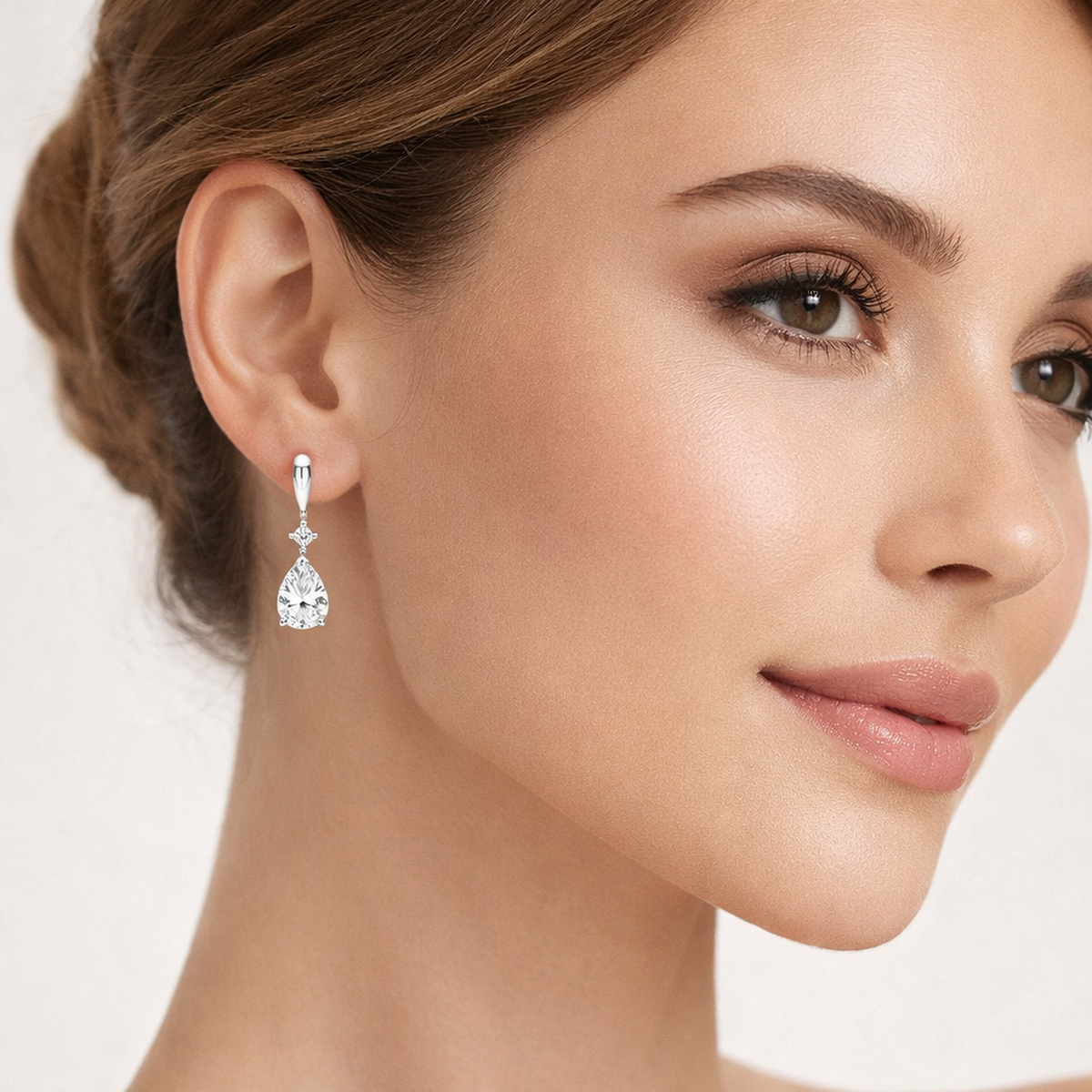 Melchior Jewellery Sterling Silver CZ Teardrop Bridal Earrings worn by woman with elegant makeup