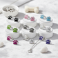 Melchior Jewellery sterling silver dog paw stud earrings for children in various colours displayed on white stands