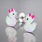 Sterling silver duck earrings for kids by Melchior Jewellery with colourful spotted design and pink bow