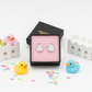 Melchior Jewellery sterling silver duck earrings for kids displayed in a gift box with colourful rubber ducks and confetti
