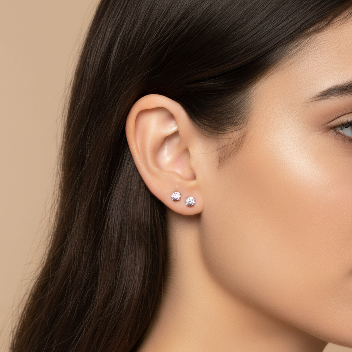 Melchior Jewellery sterling silver pink and clear stud earrings worn by woman with long dark hair