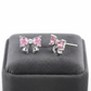 Melchior Jewellery sterling silver pink bow earrings with delicate pink gemstones on grey display