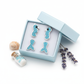 Sterling silver sea life earrings for children by Melchior Jewellery in blue and silver presented in a blue gift box