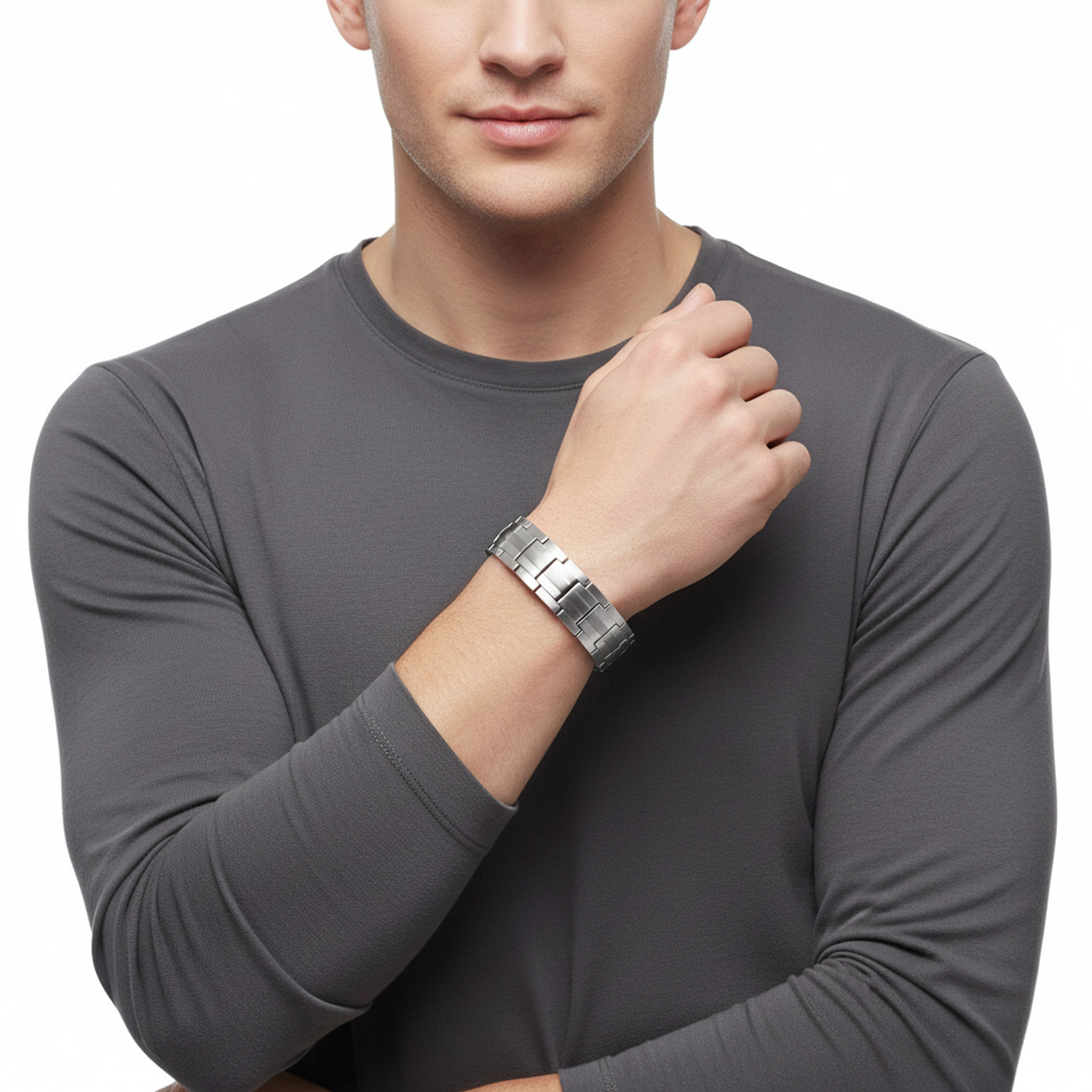 Melchior Jewellery silver titanium magnetic bracelet worn on wrist by man in grey long sleeve shirt