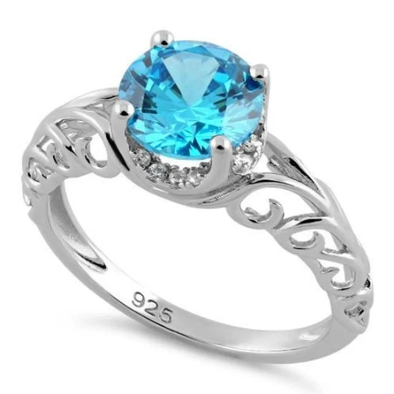 Melchior Jewellery sterling silver blue topaz ring with intricate filigree design and round blue gemstone