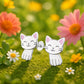 Melchior Jewellery white cat stud earrings for kids on green moss with colourful flowers background