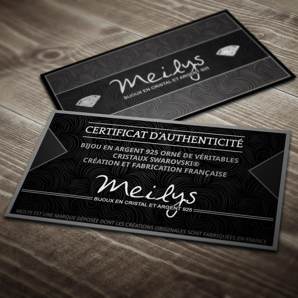 AB crystal sterling silver earrings authenticity certificate cards by Melchior Jewellery on wooden tabletop