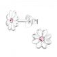 Children's sterling silver daisy earrings with pink centre stones by Melchior Jewellery