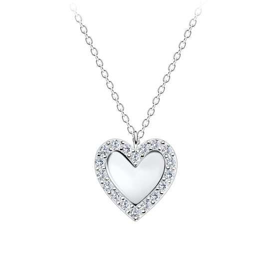 Elegant silver necklace for her featuring a heart-shaped pendant with sparkling stones by Melchior Jewellery