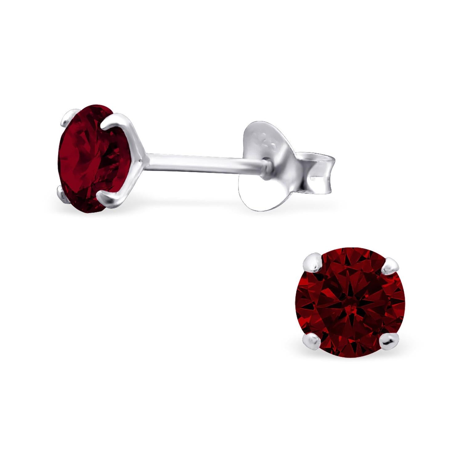 Melchior Jewellery girls birthstone stud earrings with deep red gemstone in silver setting