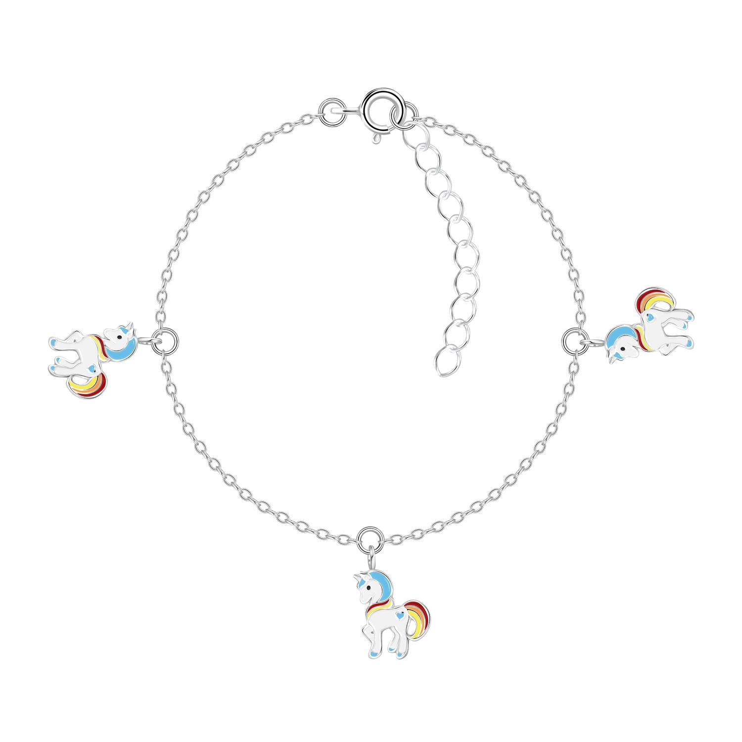 Girls silver unicorn charm bracelet by Melchior Jewellery featuring colourful rainbow manes on three unicorn charms