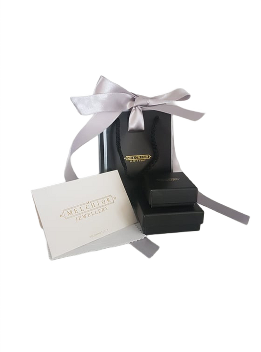 Melchior Jewellery luxury jewellery gift wrap with black boxes, shopping bag and pink ribbon bow