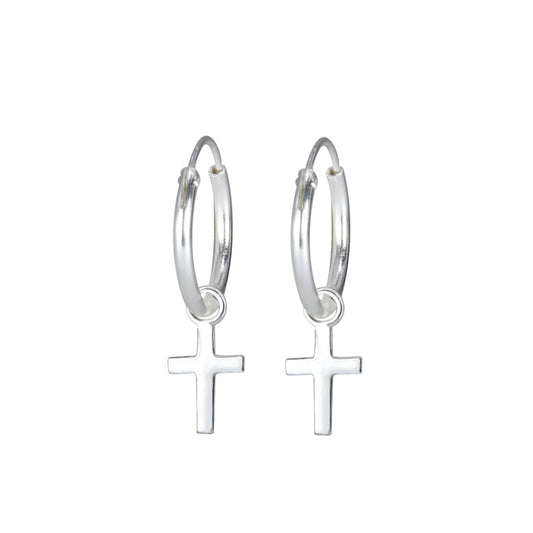 Silver cross charm earrings for girls by Melchior Jewellery with hoop design for children