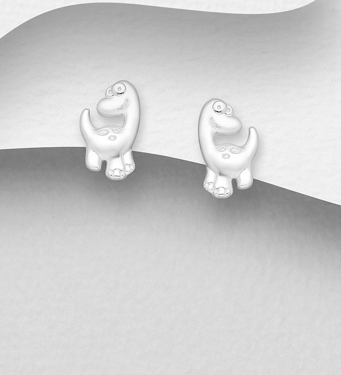 Silver dinosaur earrings for children by Melchior Jewellery featuring cute playful dinosaur design
