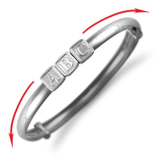 Sterling silver baby bangle by Melchior Jewellery featuring ABC letter blocks design
