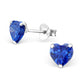 Sterling silver birthstone heart earrings with deep blue heart-shaped gemstones by Melchior Jewellery