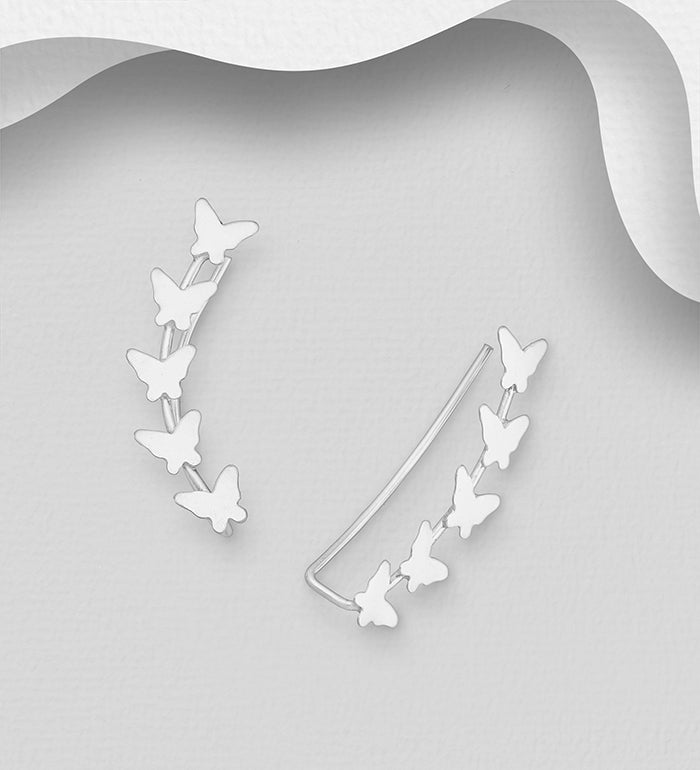Sterling silver butterfly ear climbers by Melchior Jewellery featuring delicate butterfly design