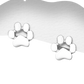 Sterling silver paw print stud earrings by Melchior Jewellery on white backing card