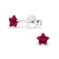 Melchior Jewellery sterling silver star birthstone earrings with deep red star studs in six prong setting